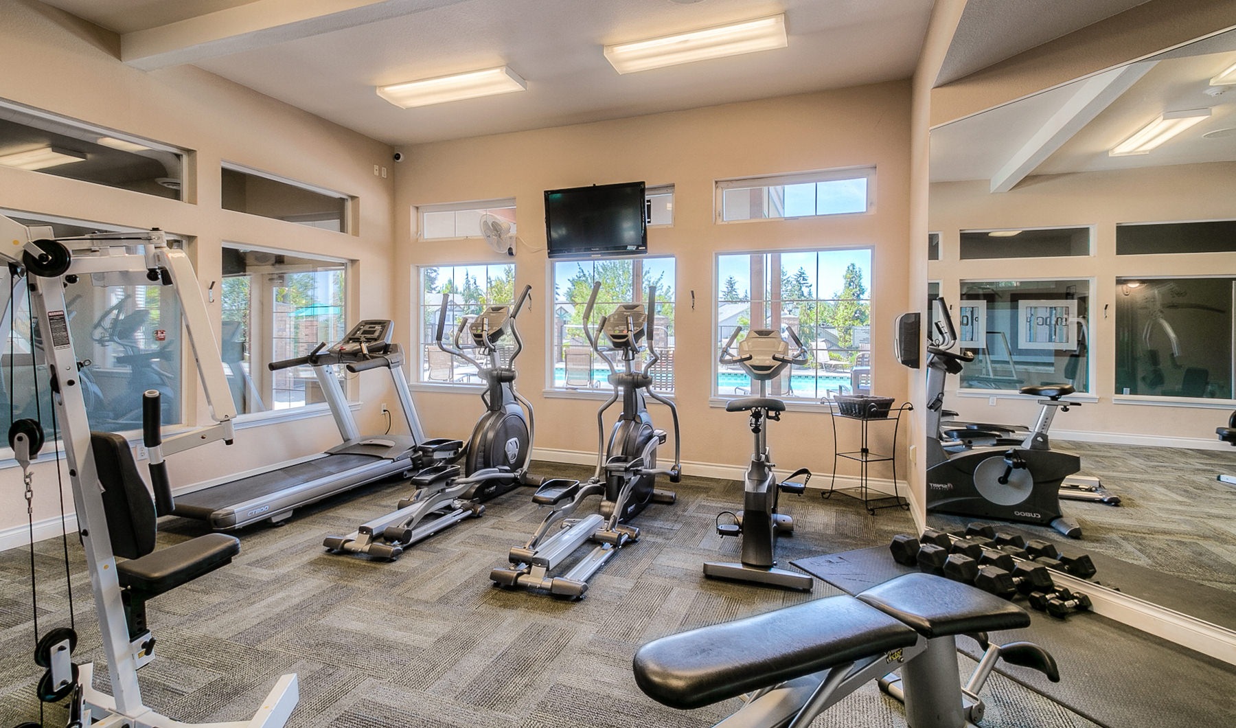 Open and well-lit fitness center Open and well-lit fitness center